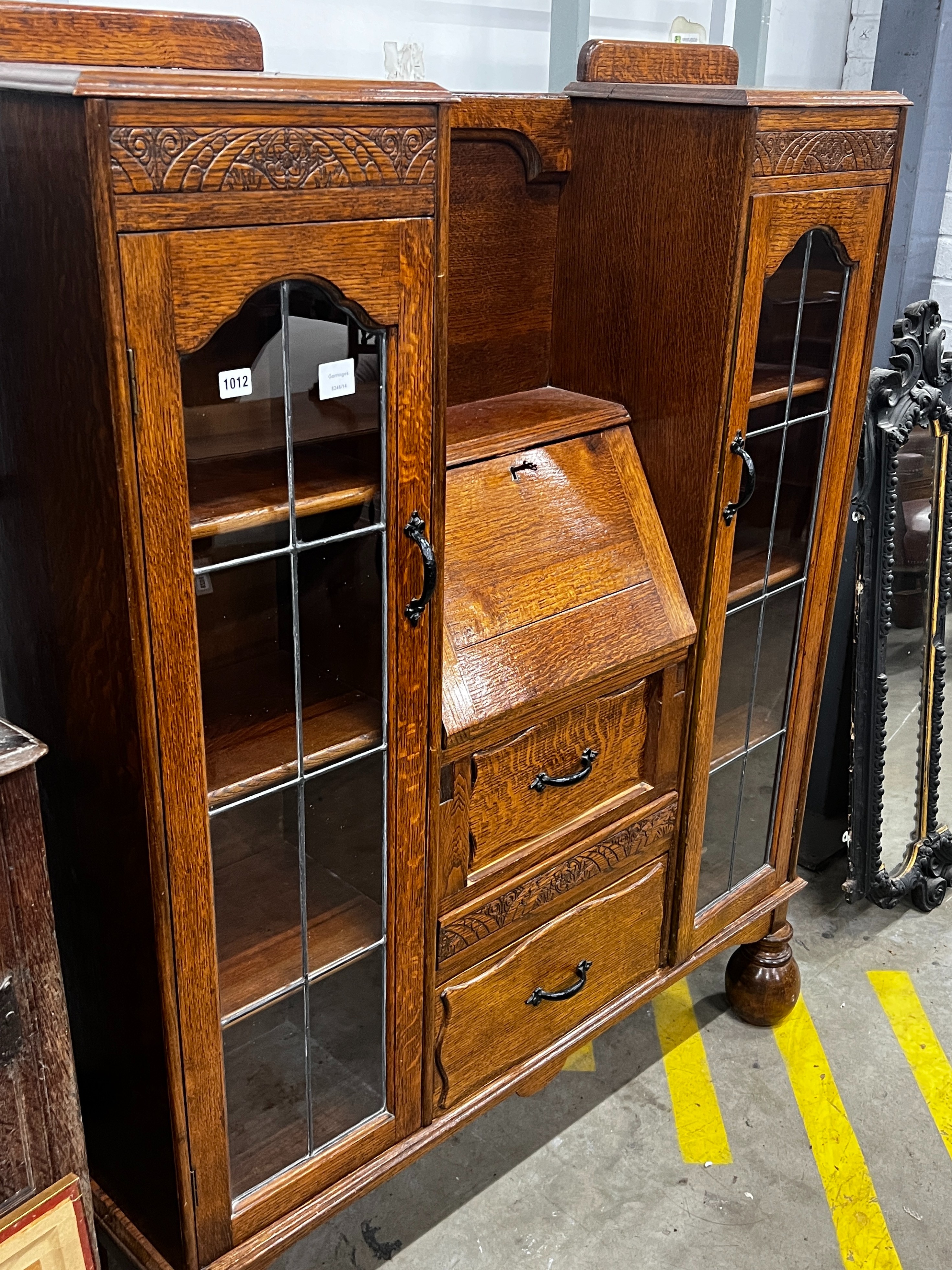 An early 20th century oak bureau bookcase, length 120cm, depth 28cm, height 154cm